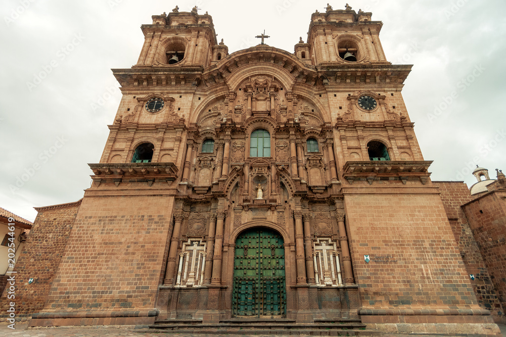 Facade of the Temple of the Company of Jesus in front of the main square of Cusco (Peru)