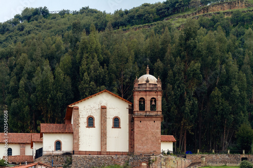 San Cristobal Church in Cusco (Peru) on the top of a hill with a grove of trees