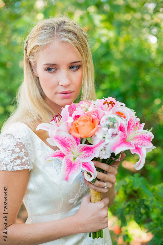 Calm bride holding her bouquet Calm bride holding her bouquet