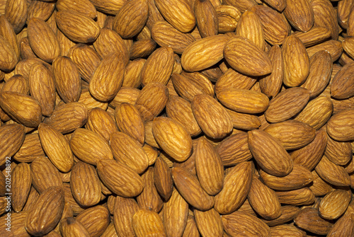 background - peeled almond kernels closeup