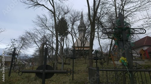 Cemetery near the Wooden Church in Oncesti  photo