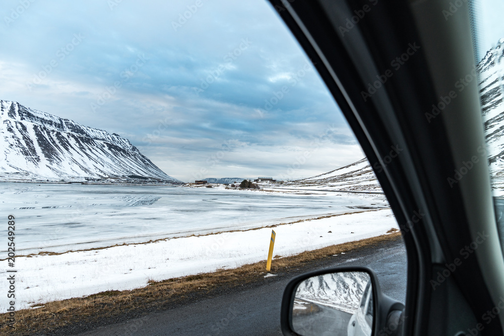 winter landscape seen through a window of a car