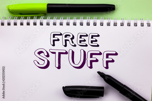 Conceptual hand writing showing Free Stuff. Business photo showcasing Complementary Free of Cost Chargeless Gratis Costless Unpaid written on Notebook Book on the Plain background Marker Pen photo