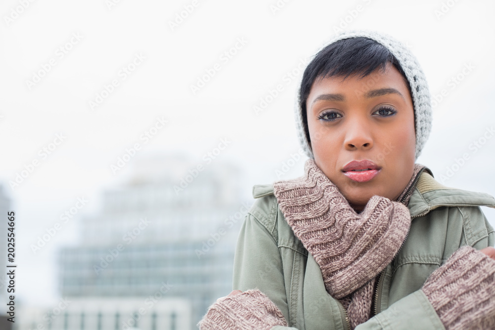 Cute young model in winter clothes shivering Cute young model in winter clothes shivering