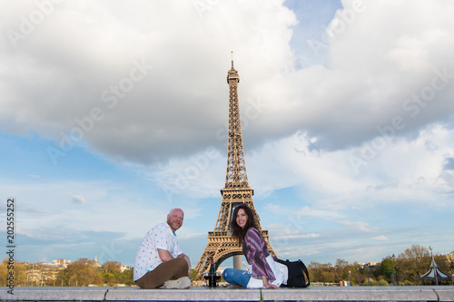 Happy couple on a romantic date at the Eiffel Tower in Paris, France © Mat Hayward