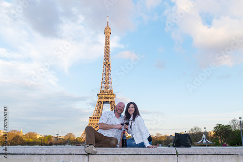 Happy couple together at the Eiffel Tower in Paris, France © Mat Hayward