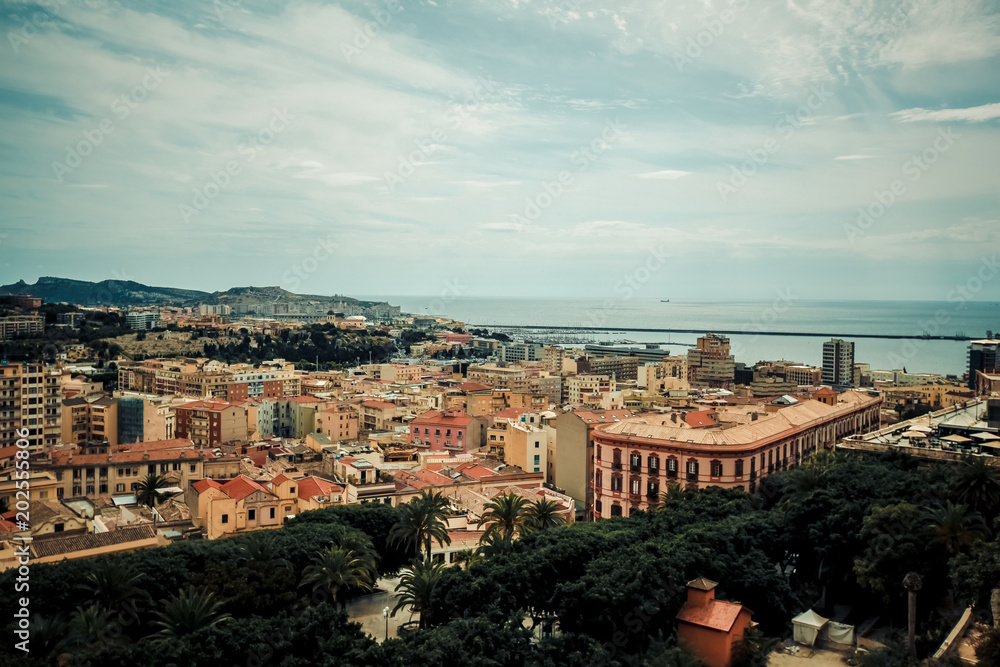 Italy Cagliari city, historical center houses and parks, europe vacations, summer landmarks buildings and trees