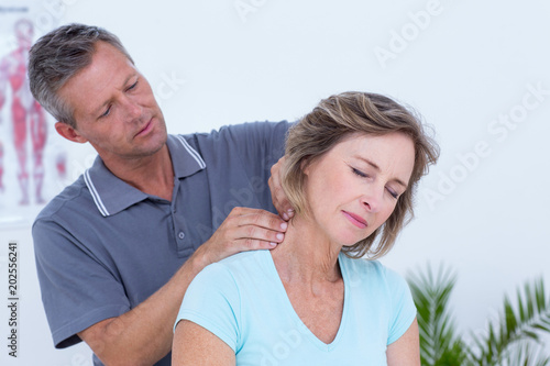 Doctor massaging his patient neck