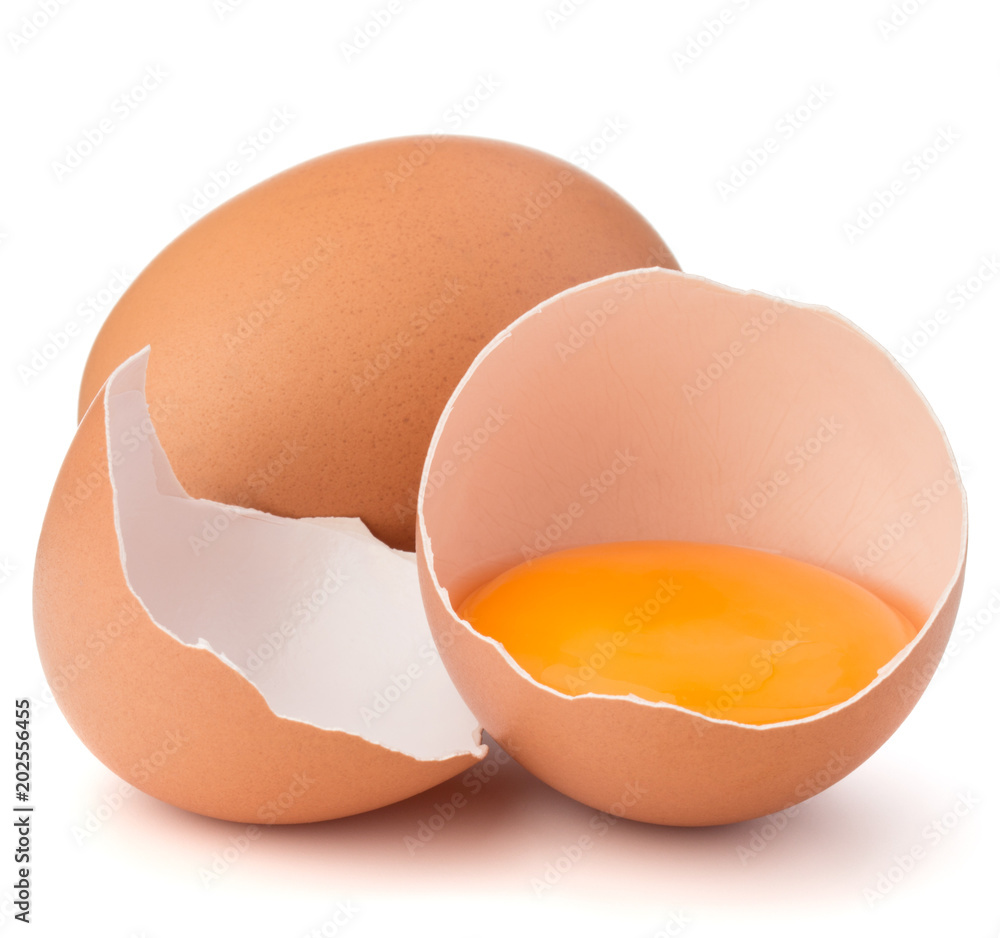 Broken egg in eggshell half and raw egg isolated on white background cutout Broken egg in eggshell half and raw egg isolated on white background cutout
