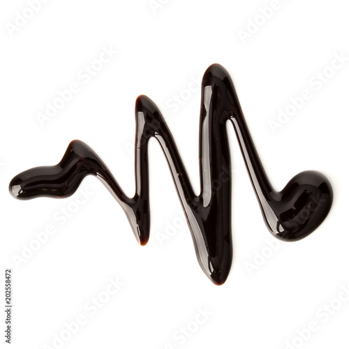 Chocolate syrup drop isolated on white background. Top view. .