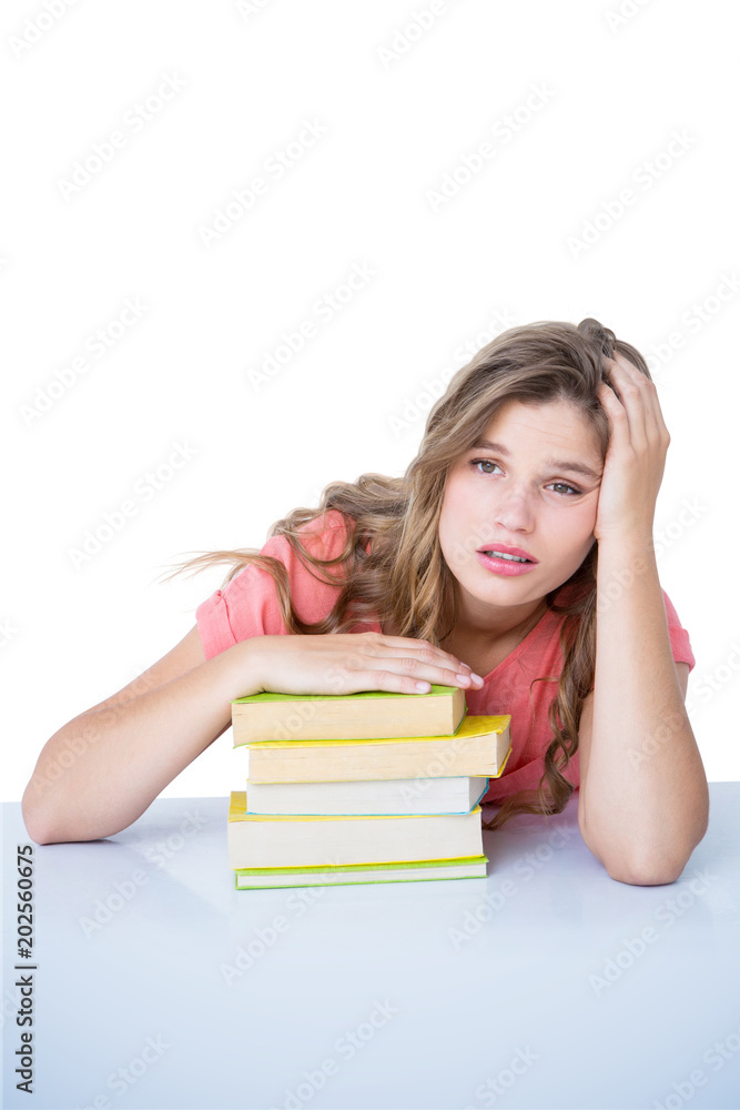 Tired hipster lying on table against white background with vignette Tired hipster lying on table against white background with vignette