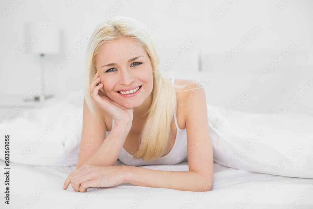 Portrait of a beautiful smiling young blond in bed Portrait of a beautiful smiling young blond in bed