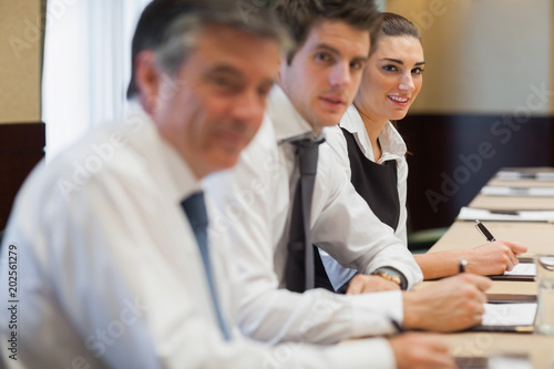 Smiling businesswoman in meeting photo