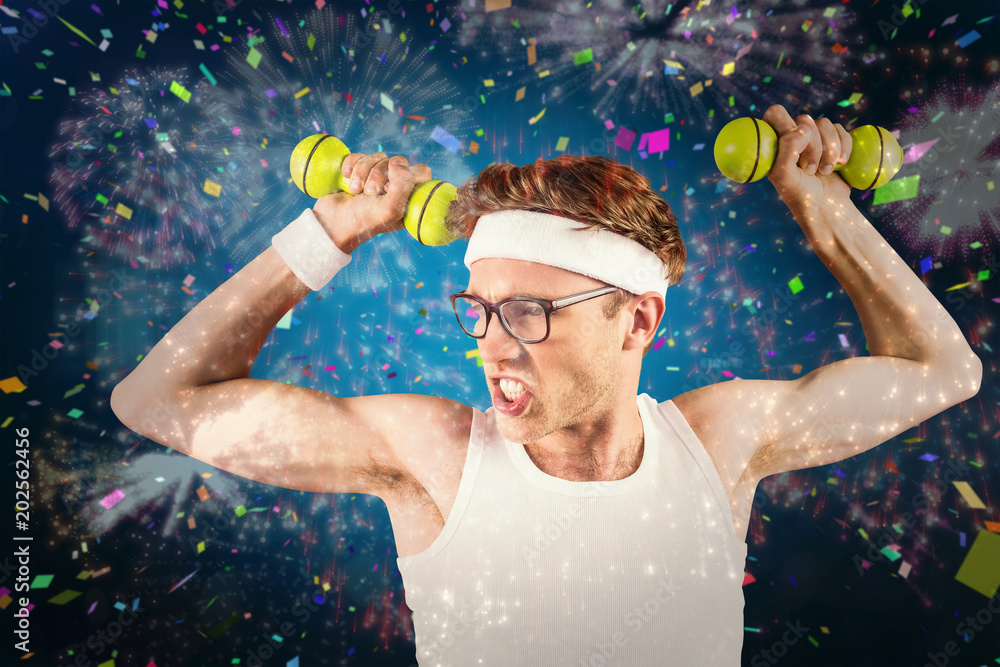 Geeky hipster posing in sportswear with dumbbells against white fireworks  exploding on black background Stock Photo | Adobe Stock