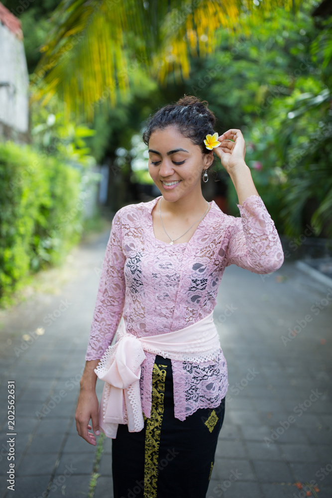 Young girl wearing traditional Balinese clothes in Bali Indonesia Stock