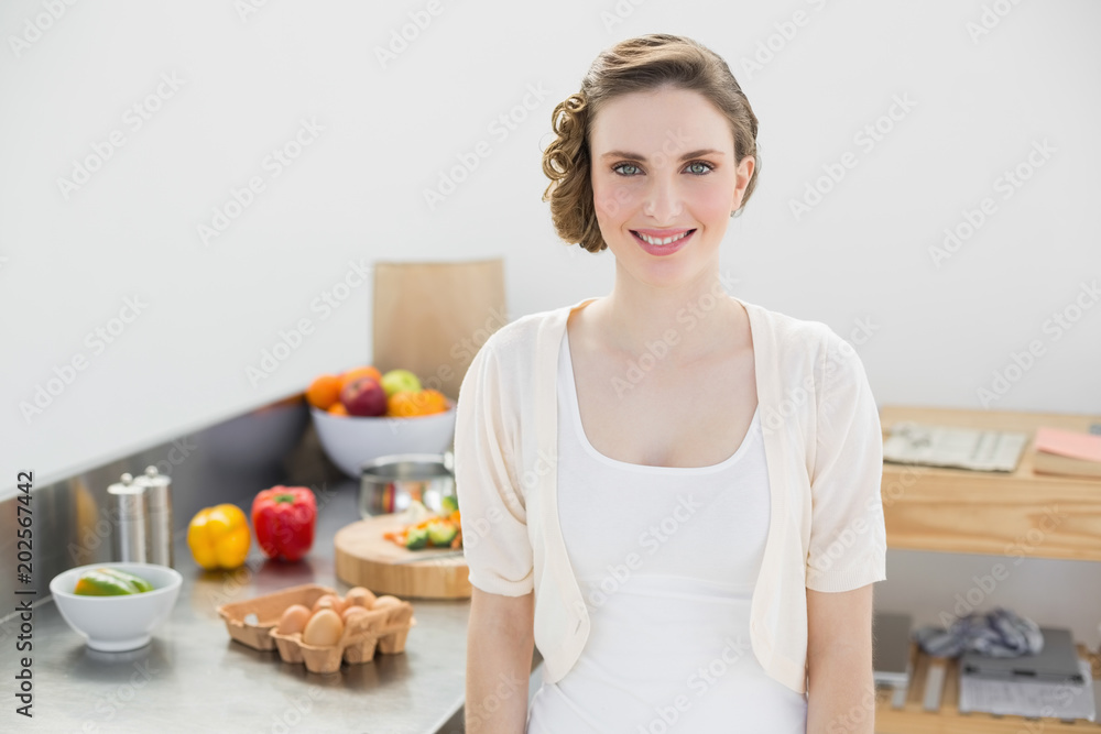Attractive brunette woman posing in her kitchen Attractive brunette woman posing in her kitchen