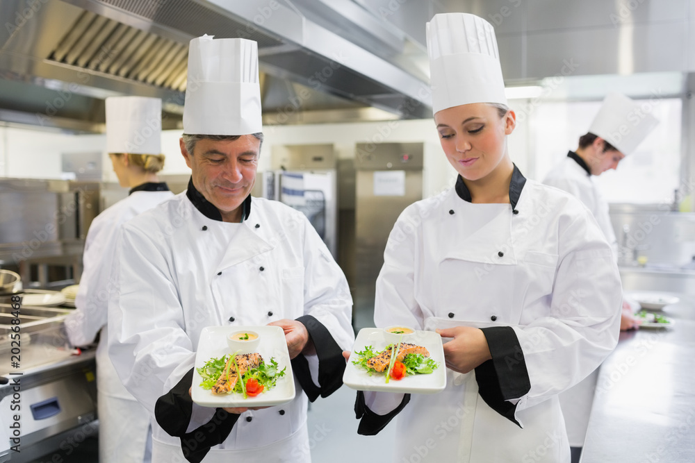 Two Chefs presenting their salmon dishes Two Chefs presenting their salmon dishes