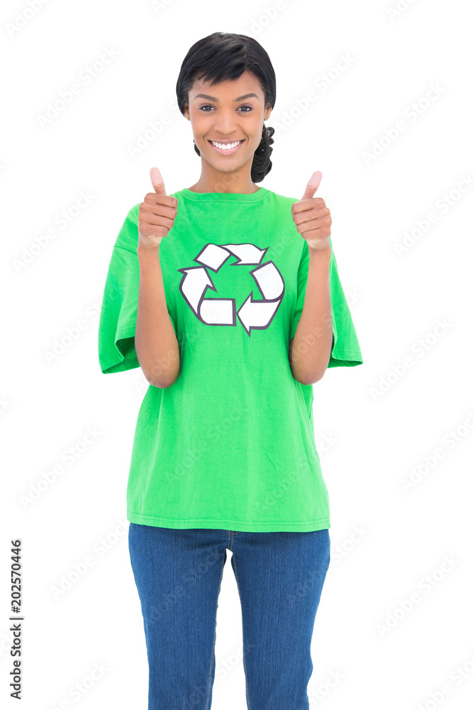 Joyful black haired ecologist posing giving thumbs up Joyful black haired ecologist posing giving thumbs up
