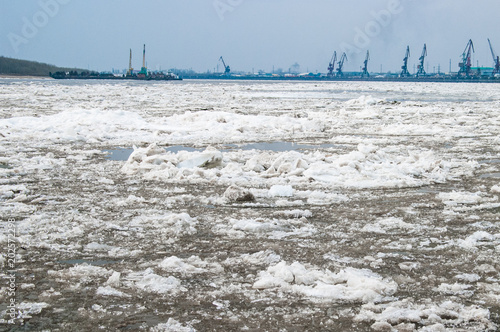 Ice on the Big River. Port Cranes on the horizon photo