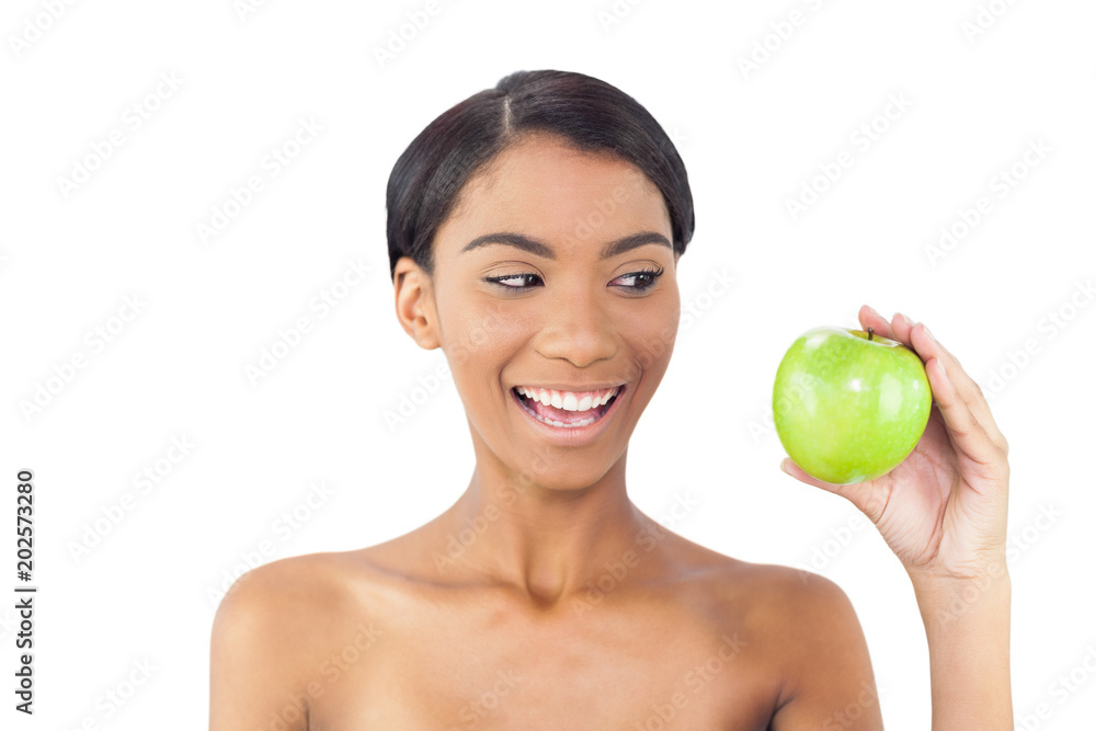 Smiling attractive model holding green apple Smiling attractive model holding green apple
