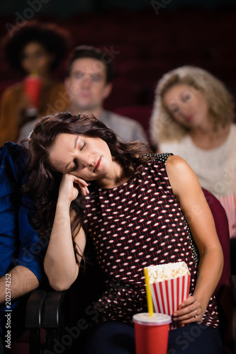 Woman sleeping in theatre