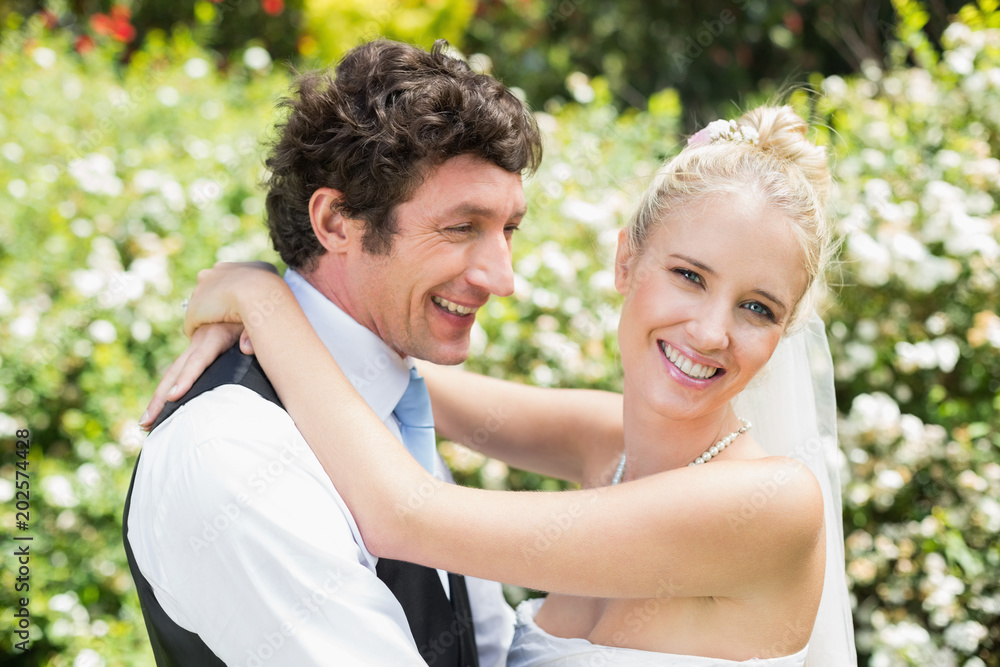 Romantic smiling newlywed couple hugging each other Romantic smiling newlywed couple hugging each other
