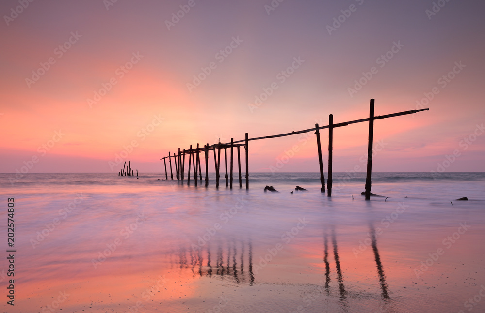 Wood bridge with seascape at twilight