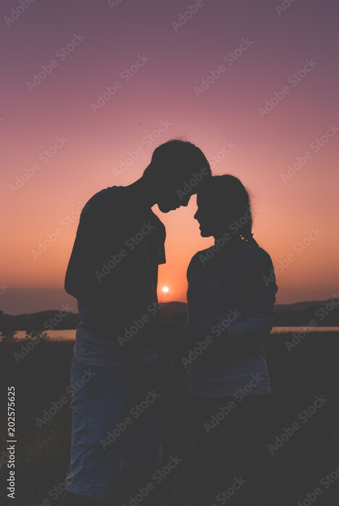 silhouette couple lover in romantic of fascinate on the beach at sunset