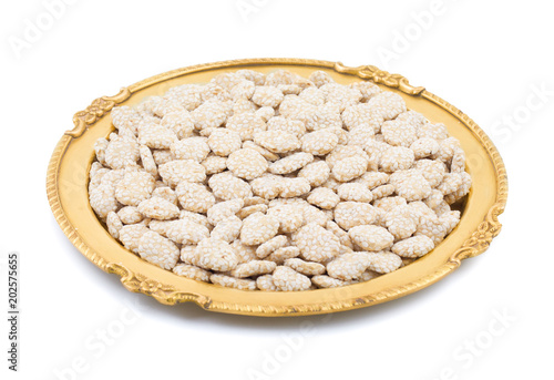 Indian Sweet Food Rewri also know as rewadi are popular in the Indian makar sankranti festival, Rewri is crisp toffee like dessert made from gudh (with spices) with coating of sesame seeds. photo