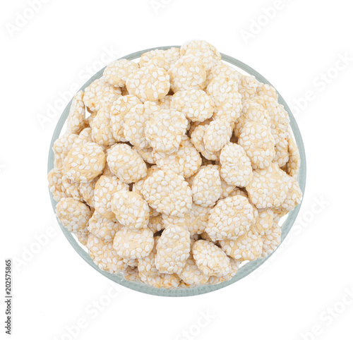 Indian Sweet Food Rewri also know as rewadi are popular in the Indian makar sankranti festival, Rewri is crisp toffee like dessert made from gudh (with spices) with coating of sesame seeds. photo