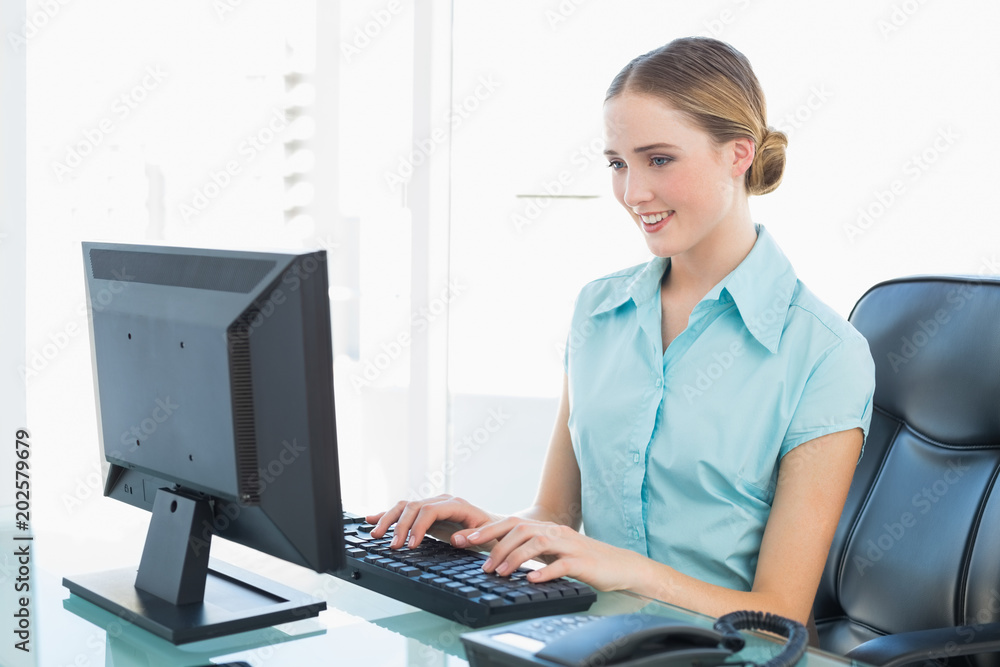 Classy happy businesswoman working at computer Classy happy businesswoman working at computer