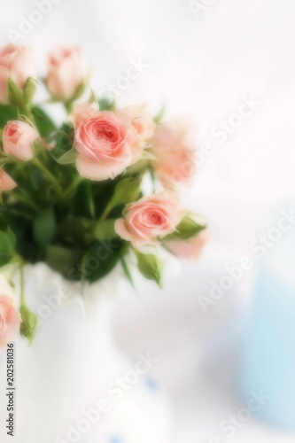 Blur effect  soft focus flowers background with bouquet of pale pink  roses .Beautiful Holiday background.copy space.