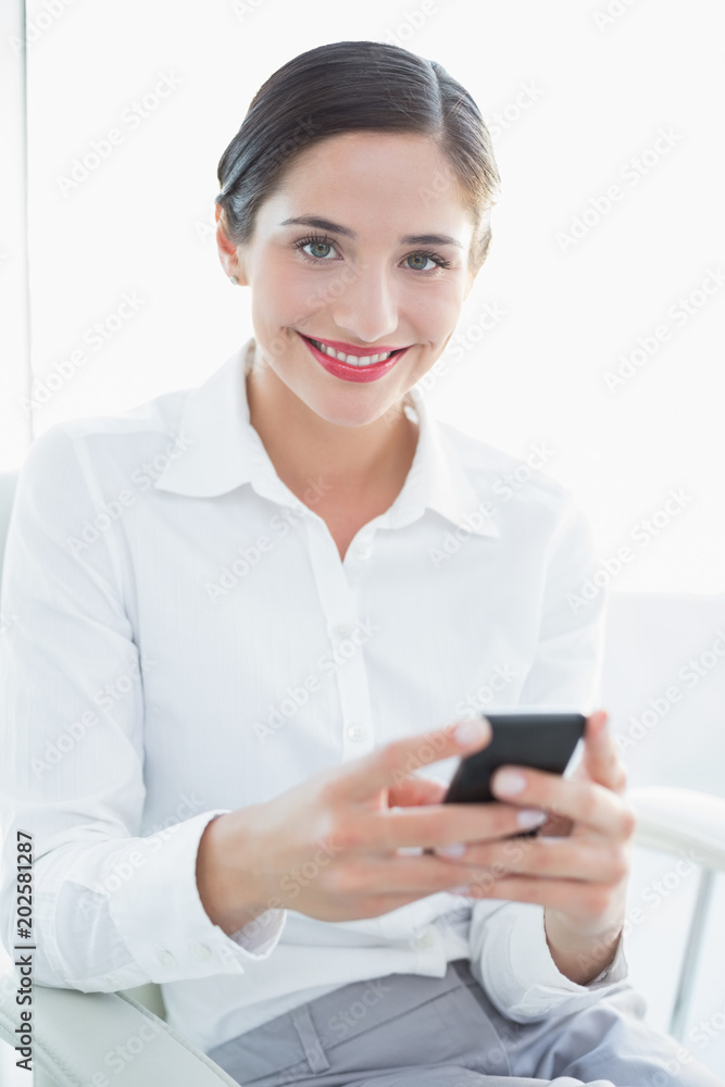 Smiling business woman with mobile phone Smiling business woman with mobile phone