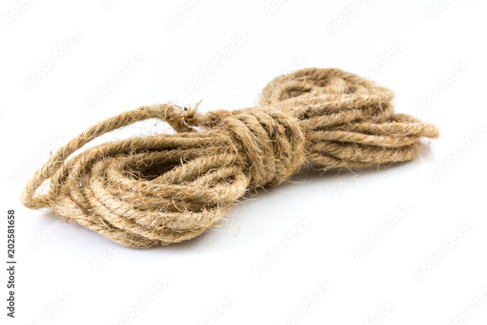 Small coiled rope on white background.