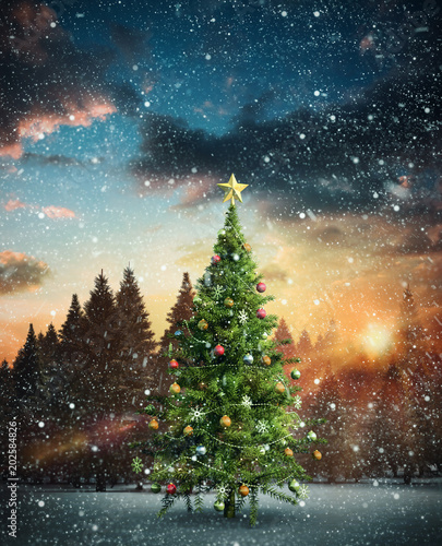 Composite image of christmas tree against fir tree forest in snowy landscape © vectorfusionart