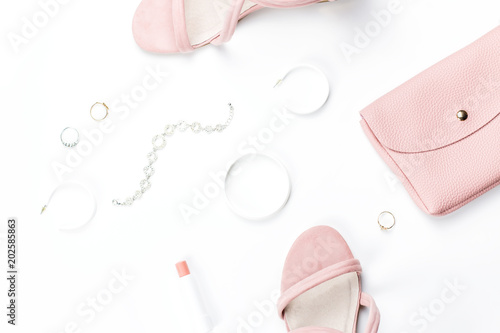 Fashion accessories, make up products, sandals and handbag on white background. Beauty and fashion concept, flat lay