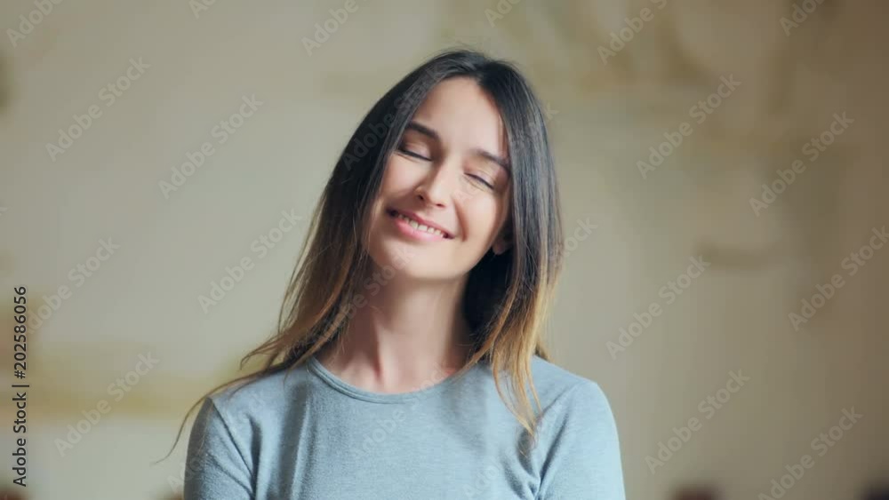 Young smiling attractive brunette woman looking at the camera Young smiling attractive brunette woman looking at the camera