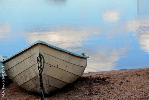 Rowboat on a lake waiting for adventure photo