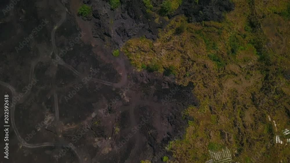 Top view of black lava terrain and volcanic soil volcano Batur drone footage Top view of black lava terrain and volcanic soil volcano Batur drone footage