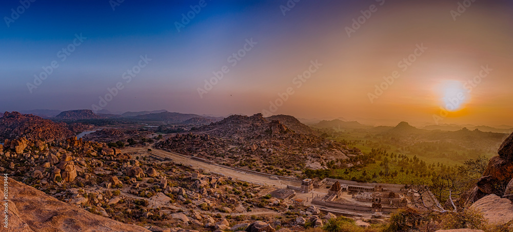 Sunrise over courtesan Street and a view of Tungabhadra river, as viewed from atop Matanga Hill in Hampi, India