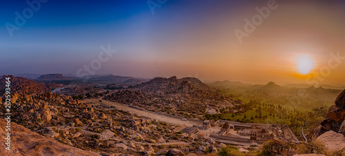 Sunrise over courtesan Street and a view of Tungabhadra river, as viewed from atop Matanga Hill in Hampi, India