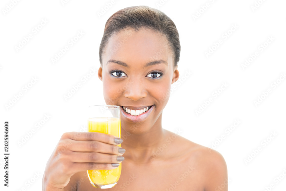 Smiling natural beauty holding glass of orange juice Smiling natural beauty holding glass of orange juice
