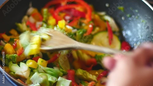 Cooking a stir fry with some spicy and tasty vegetables. 4k video photo