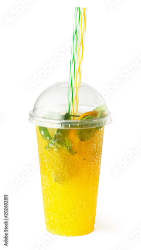 Orange lemonade in plastic glass, cooling fruit drink