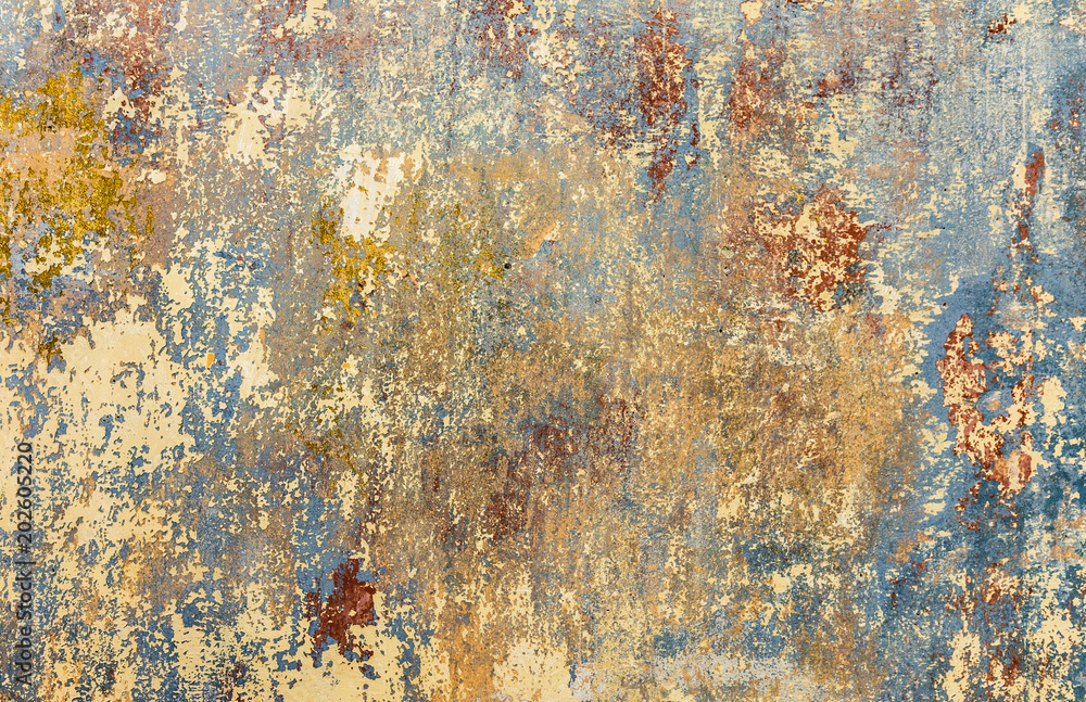 old grunge wall of an old house with remainings of color old grunge wall of an old house with remainings of color
