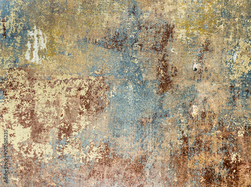 old grunge wall of an old house with remainings of color