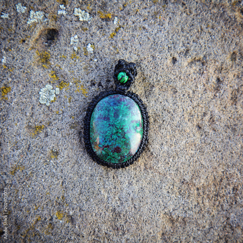 Natural gemstone necklace on stone background