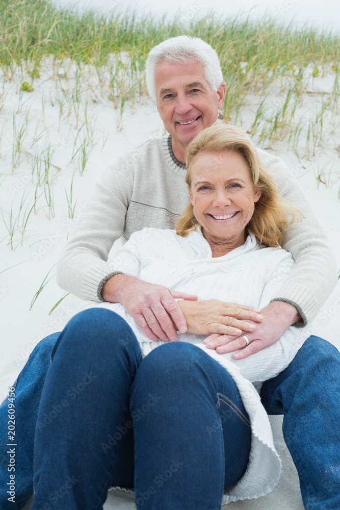 Romantic senior couple relaxing at beach Romantic senior couple relaxing at beach
