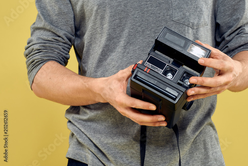 retro camera man gray jacket