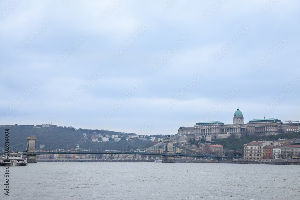 Buda Castle seen from Pest with the Danube and Szechenyi Chain Bridge in front.  The cast is the historical palace complex of the Hungarian kings